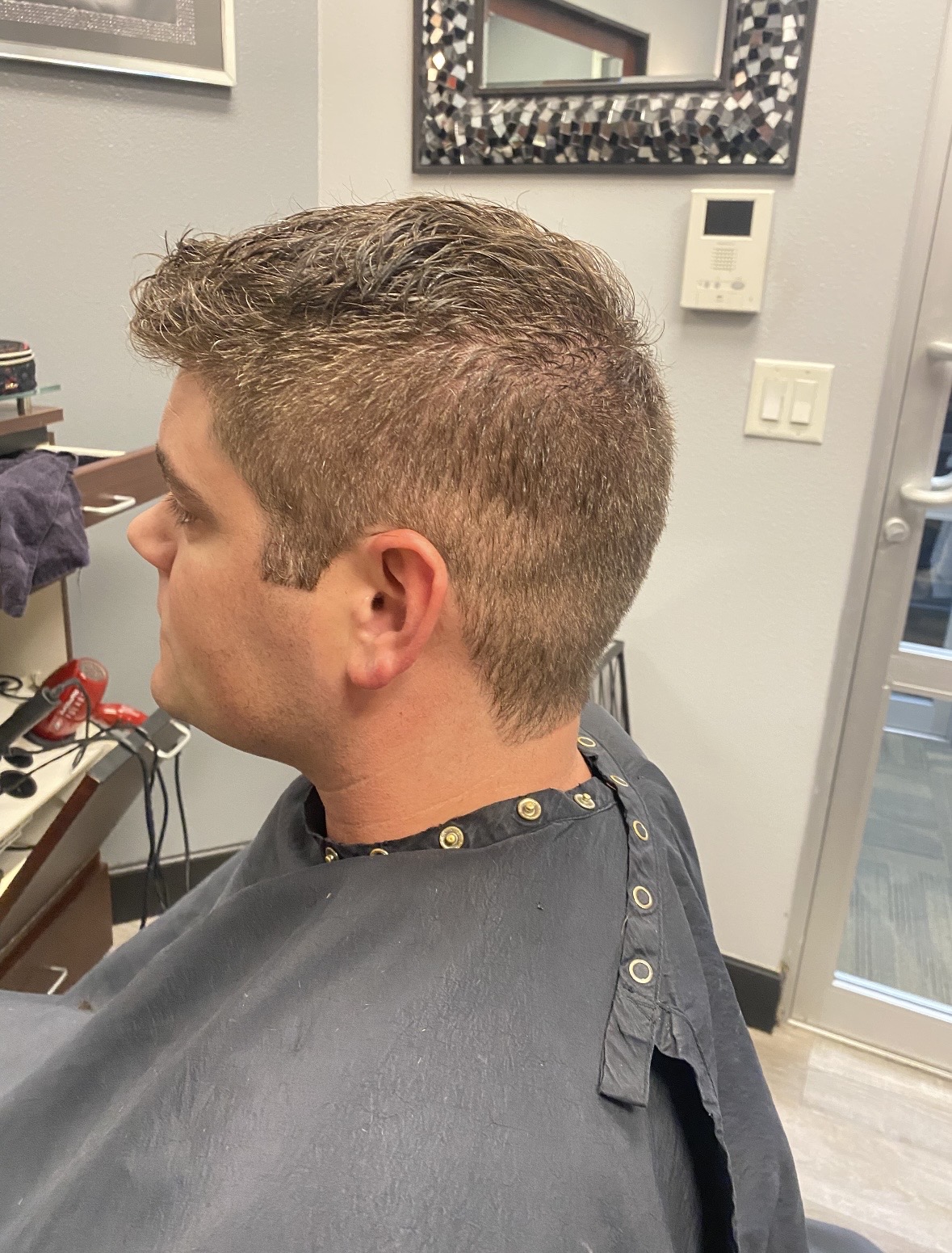 Men's tapered haircut with textured top by HairWorx Sarasota