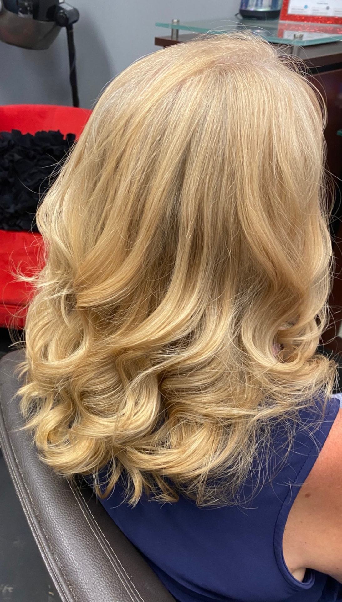 Blonde cut and style with soft bouncy curls